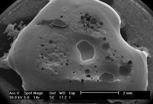 splat-cooled nickel with craters and dendrites (not visible on this scale)